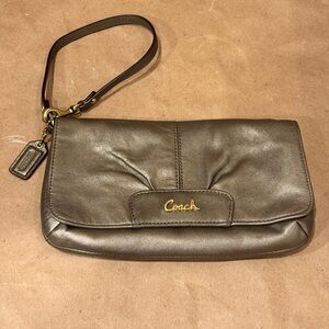 Coach Ashley Bronze Leather Large Flap Wristlet. 8.5” by 5” by 0.5”